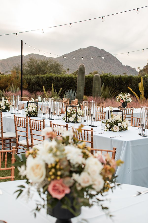 Elegant outdoor wedding ceremony at Andaz Scottsdale with Camelback Mountain in the background