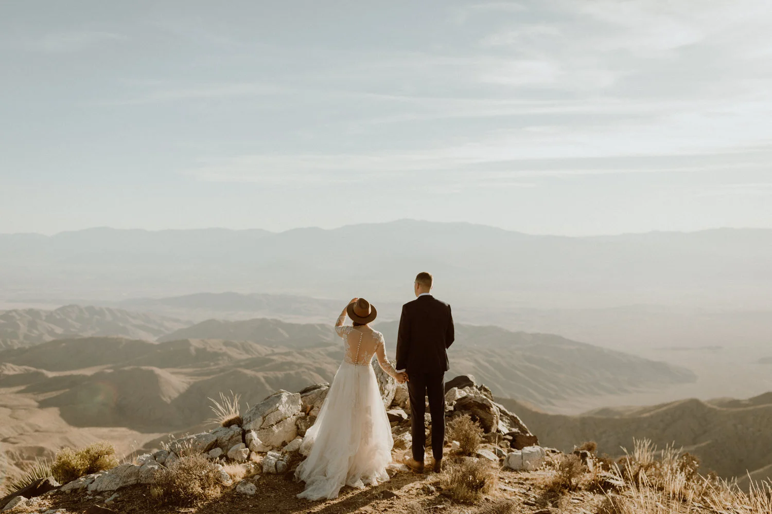 Joshua Tree desert wedding with glowing boulders and silhouettes at golden hour