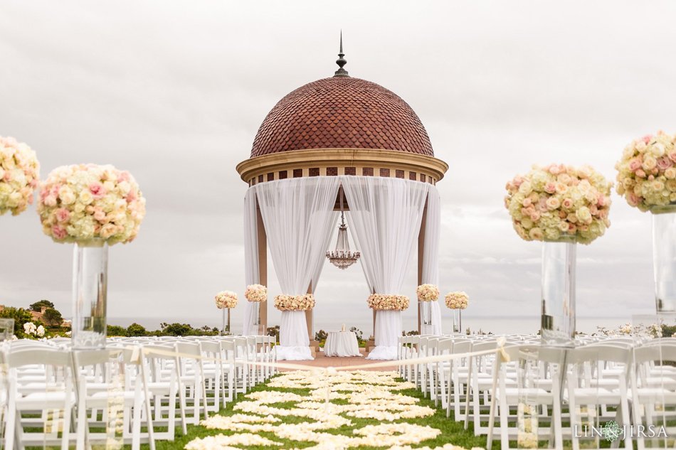 Pelican Hill Rotunda Ceremony, Newport Coast Pelican Hill Resort rotunda wedding ceremony with white draping and tall floral arrangements.