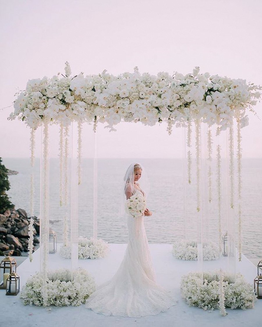 Luxury Oceanfront Wedding Ceremony at Terranea Resort, Los Angeles Bride beneath a floral canopy overlooking the Pacific Ocean at Terranea Resort in Los Angeles.