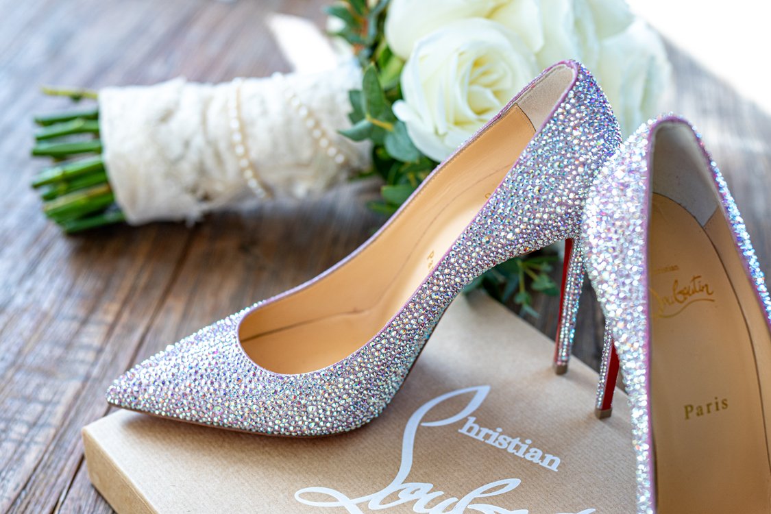 Bride and groom walking together through golden light at vineyard estate wedding