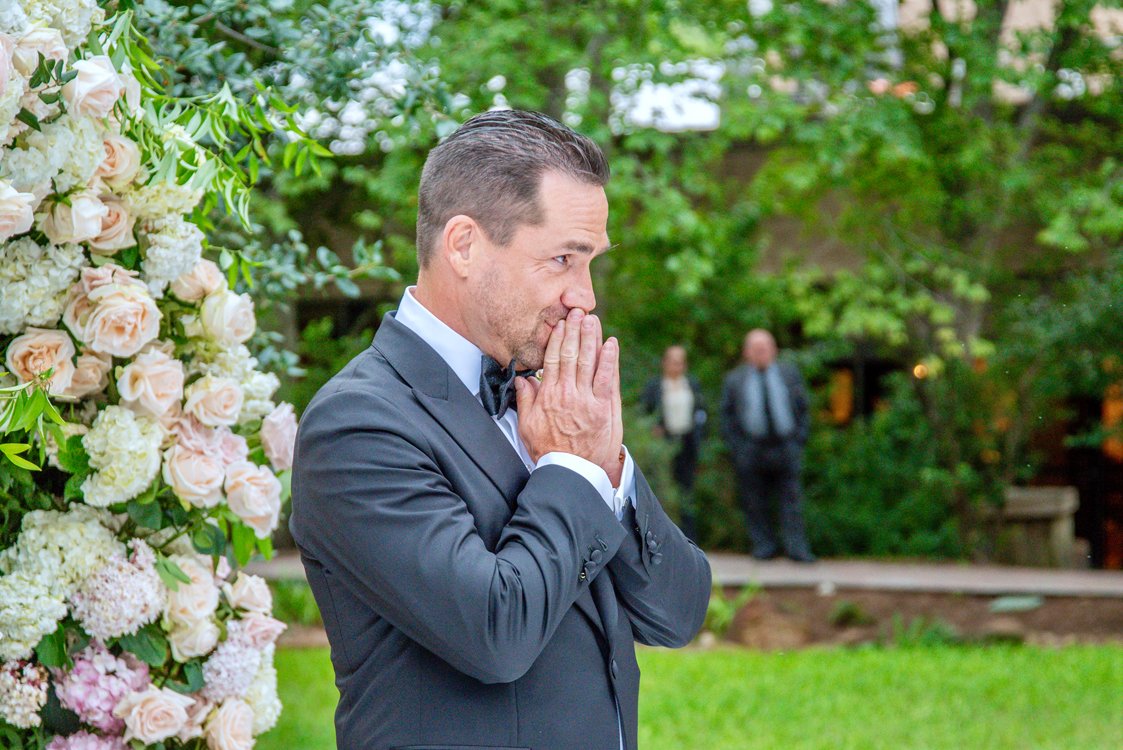 Groom seeing his bride for the first time during outdoor Arizona wedding ceremony