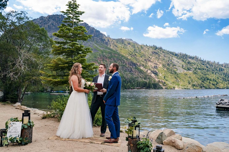 Intimate lakeside wedding at Lake Tahoe with mountain backdrop.
