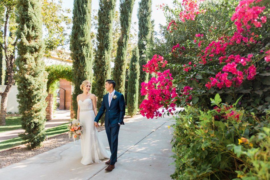 Cypress Walkway and Bougainvillea—Mediterranean Garden Wedding Vibe Bride and groom walking through cypress-lined garden with vibrant bougainvillea