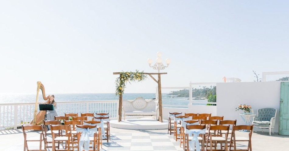 Intimate Seaside Wedding at Occasions at Laguna Village Intimate oceanfront ceremony setup at Occasions at Laguna Village with coastal terrace seating.