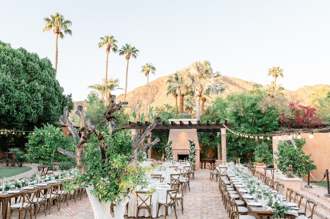 Royal Palms Resort wedding ceremony among palms and terracotta architecture