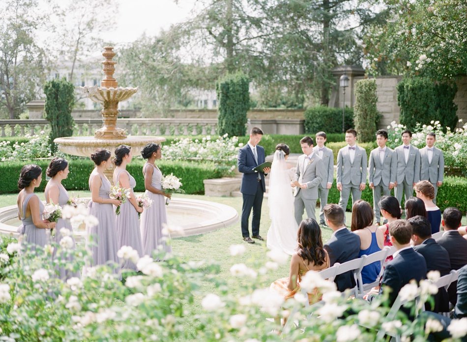 Classic garden ceremony by a historic fountain in Southern California—destination wedding by car from Phoenix.