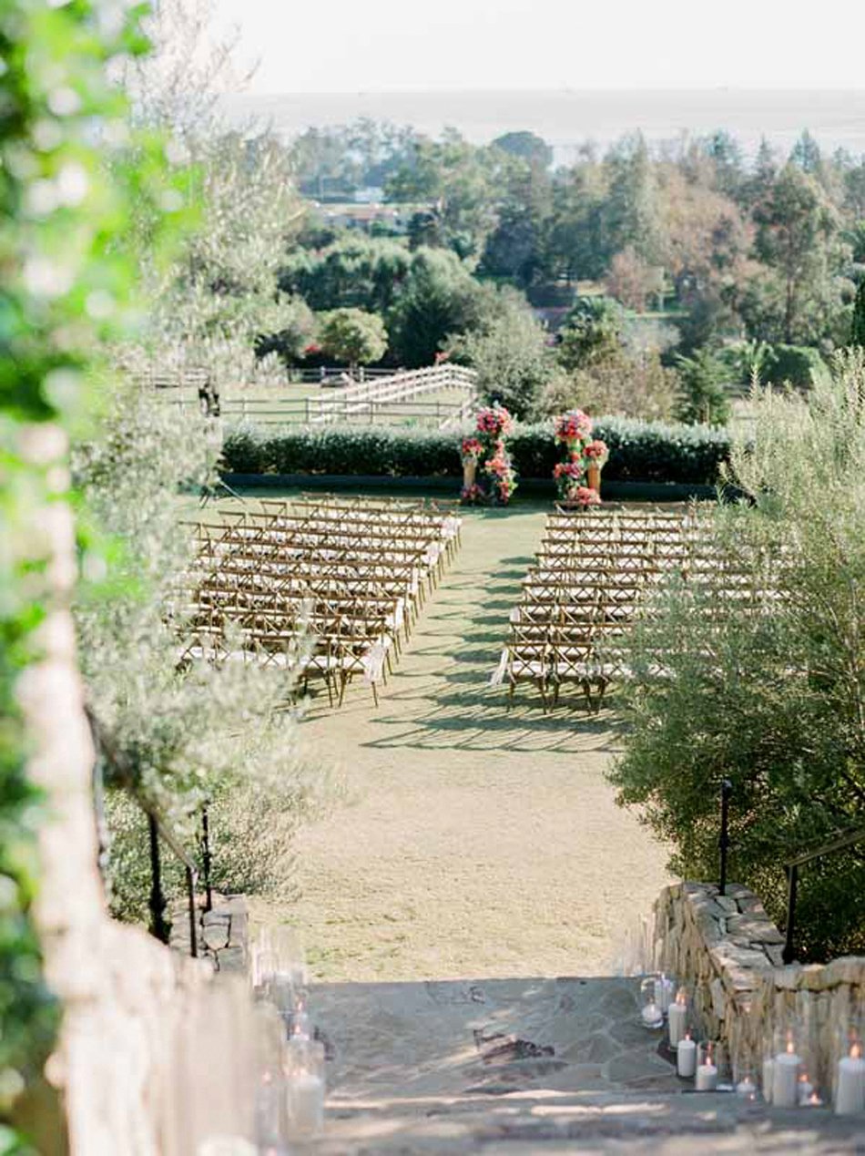 Olive-grove ceremony setting with ocean-hill views—Southern California venue drivable from Phoenix.
