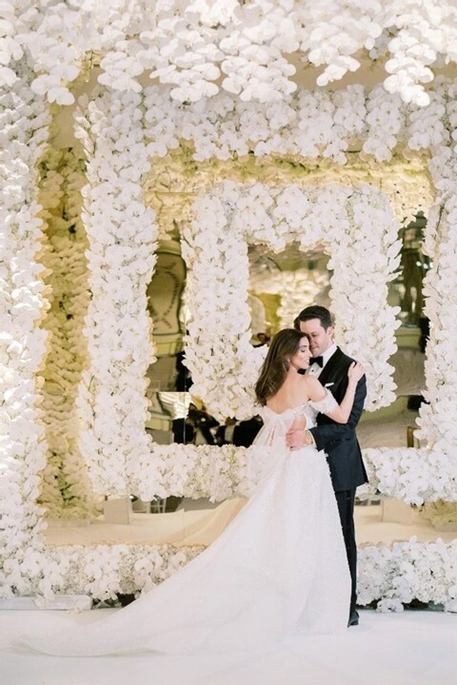 Floral Ballroom Wedding at The Beverly Hills Hotel Bride and groom sharing first dance at The Beverly Hills Hotel ballroom.