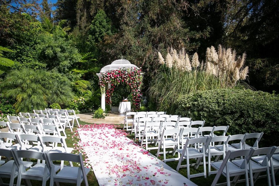 Hotel Bel-Air Garden Gazebo Ceremony Intimate white gazebo ceremony surrounded by lush greenery and pampas at a Beverly Hills resort.