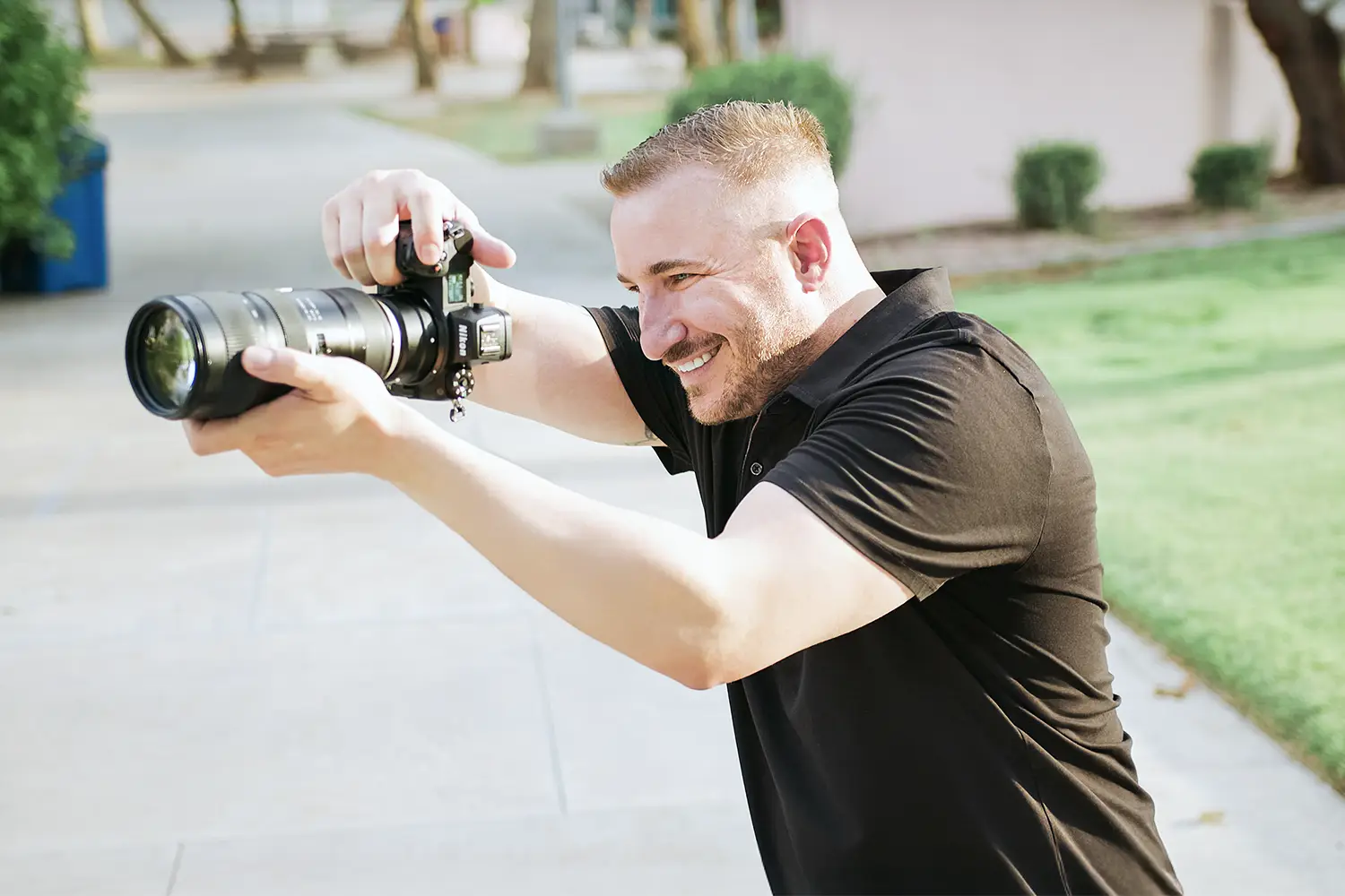 Travis, lead Arizona wedding photographer and creative director of Lovelee Photography, capturing candid wedding moments<br />
