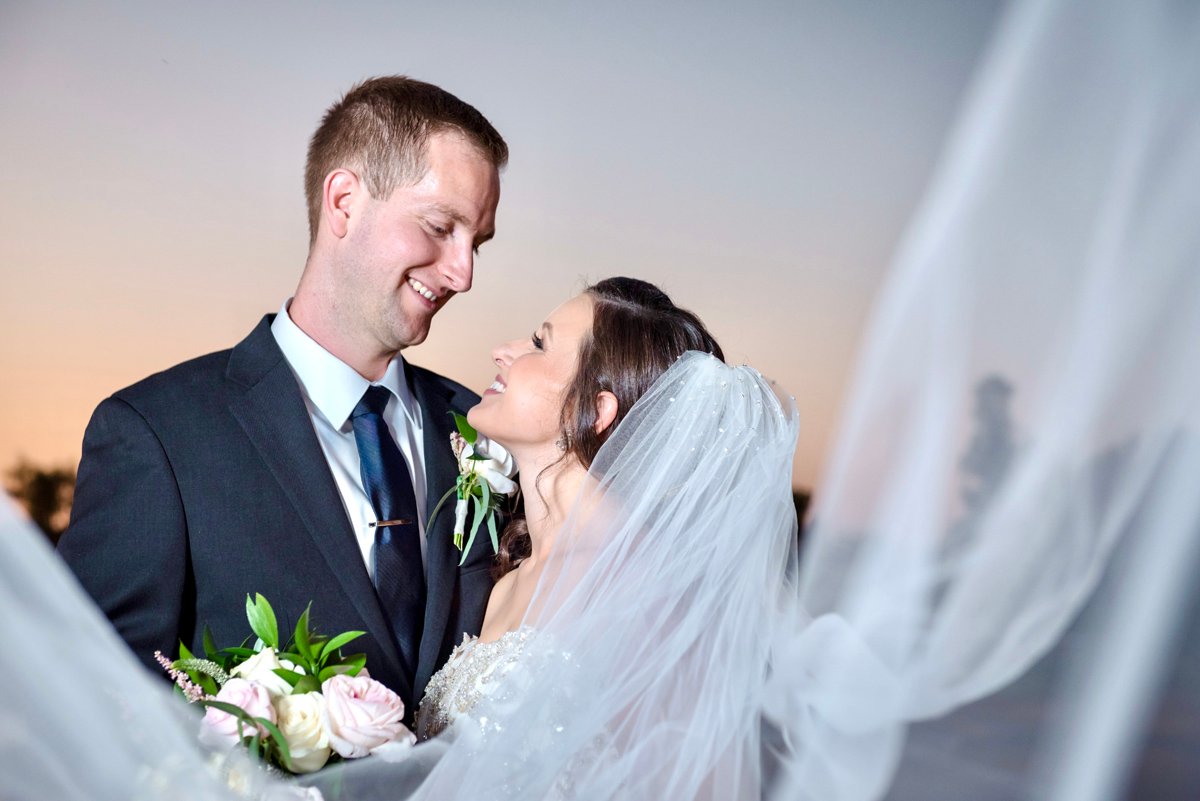 Bride and groom sharing an intimate embrace, photographed by an Arizona wedding photographer