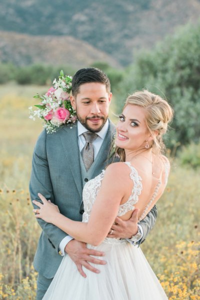 Elegant bride and groom embracing after their desert wedding in Phoenix, Arizona — photographed by Lovelee Photography
