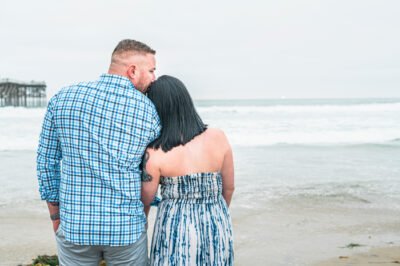 beach-engagement-couple-embrace-southern-californi a