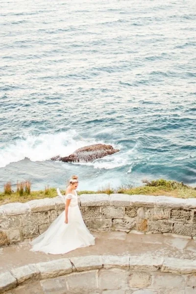 Bridal portrait on coastal stone terrace — Southern California coast — Lovelee Photography